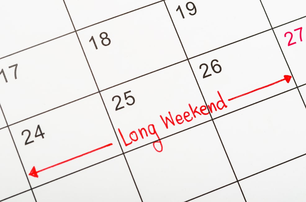 Long weekend red text written on a calendar