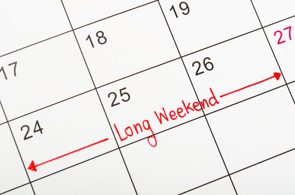 Long weekend red text written on a calendar